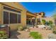 Landscaped backyard featuring multiple patios, a barbecue, and desert landscaping for easy maintenance at 23133 N 73Rd Pl, Scottsdale, AZ 85255