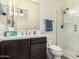 Well-lit bathroom features a vanity with great storage, a large mirror, and a shower at 23133 N 73Rd Pl, Scottsdale, AZ 85255