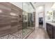 Stylish bathroom with large glass-enclosed shower and modern fixtures at 23133 N 73Rd Pl, Scottsdale, AZ 85255