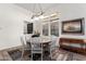 Cozy dining area with modern lighting, neutral colors, and windows for plenty of natural light at 23133 N 73Rd Pl, Scottsdale, AZ 85255