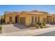 Charming single-story home featuring a terracotta roof, desert landscaping, and a two-car garage at 23133 N 73Rd Pl, Scottsdale, AZ 85255