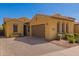 Attractive single-story home showcases terracotta roofing, desert landscaping, and an attached two-car garage at 23133 N 73Rd Pl, Scottsdale, AZ 85255