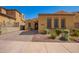 Inviting single-story home boasting desert landscaping, a brick driveway, and a quaint front entryway at 23133 N 73Rd Pl, Scottsdale, AZ 85255