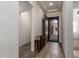 Bright and airy foyer featuring stylish flooring, an elegant front door, and a view of the living area at 23133 N 73Rd Pl, Scottsdale, AZ 85255