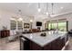 Large kitchen island with breakfast bar in an open-concept layout, perfect for entertaining guests and Gathering at 23133 N 73Rd Pl, Scottsdale, AZ 85255