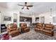 Spacious living room with a ceiling fan that is open to the kitchen and dining area at 23133 N 73Rd Pl, Scottsdale, AZ 85255