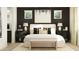 Well-lit bedroom with neutral tones, stylish decor, and bedside tables with lamps at 25224 N 174Th Ave, Surprise, AZ 85387