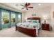 Comfortable bedroom featuring a ceiling fan, bay window, and stylish furnishings at 26288 W Horsham Ct, Buckeye, AZ 85396