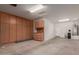 Spacious garage with built-in storage cabinets and utility sink at 26288 W Horsham Ct, Buckeye, AZ 85396