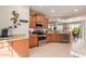 Well-lit kitchen featuring granite countertops, stainless steel appliances, and breakfast nook with views at 26288 W Horsham Ct, Buckeye, AZ 85396