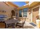 Charming patio with barbecue, outdoor seating, and terracotta tile roofing accents at 26288 W Horsham Ct, Buckeye, AZ 85396