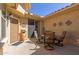 Private patio with an outdoor dining set, perfect for entertaining or relaxing outdoors at 26288 W Horsham Ct, Buckeye, AZ 85396