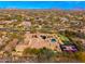 Expansive aerial view of estate showcasing tile roof, pool, putting green, and basketball court at 27632 N 68Th Pl, Scottsdale, AZ 85266