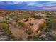 Expansive desert estate with a terracotta roof and picturesque landscaping at 27632 N 68Th Pl, Scottsdale, AZ 85266