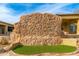 Unique backyard showcasing a rock climbing wall feature next to the house at 27632 N 68Th Pl, Scottsdale, AZ 85266