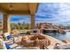 This luxurious backyard includes a stone fire pit, a putting green, a rock waterfall, and a refreshing pool at 27632 N 68Th Pl, Scottsdale, AZ 85266