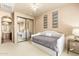 Cozy bedroom featuring a daybed, mirrored closet, and decorative wall art at 27632 N 68Th Pl, Scottsdale, AZ 85266