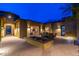 Beautiful desert home courtyard featuring a tranquil water feature, outdoor seating and architectural details at 27632 N 68Th Pl, Scottsdale, AZ 85266