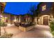 Private courtyard with seating area and fire feature, complemented by paver stones and architectural details at 27632 N 68Th Pl, Scottsdale, AZ 85266