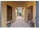 Elegant entryway with brick flooring, arched ceilings, and rustic wooden doors at 27632 N 68Th Pl, Scottsdale, AZ 85266