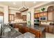 Gourmet kitchen with custom cabinetry, granite counters, and stainless appliances at 27632 N 68Th Pl, Scottsdale, AZ 85266