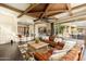 Bright and airy living room featuring a bar area, an expansive outdoor view, and comfortable leather seating at 27632 N 68Th Pl, Scottsdale, AZ 85266