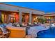 Covered patio and backyard pool with a swim up bar and plenty of lounge seating at 27632 N 68Th Pl, Scottsdale, AZ 85266