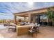 Outdoor entertaining area with bar seating, lounge furniture, and a pool at 27632 N 68Th Pl, Scottsdale, AZ 85266