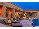 Covered patio with lounge seating and backyard pool at 27632 N 68Th Pl, Scottsdale, AZ 85266