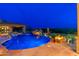 Backyard pool with a slide, hot tub, rock fire pit, and a covered patio at 27632 N 68Th Pl, Scottsdale, AZ 85266