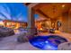 Inviting backyard featuring a pool, spa, fire pit, and covered patio perfect for outdoor entertaining at 27632 N 68Th Pl, Scottsdale, AZ 85266