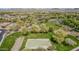 An aerial shot capturing the community park with a basketball court, green space, and lush trees at 27792 N 129Th Ln, Peoria, AZ 85383