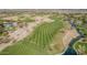 Overhead image of the manicured golf course, a scenic lake, and desert landscape at 27792 N 129Th Ln, Peoria, AZ 85383