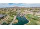 Scenic aerial view of a golf course with water features and palm trees in a desert community at 27792 N 129Th Ln, Peoria, AZ 85383