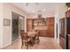 Lovely eat-in kitchen featuring built-in cabinets, tile floors, and backyard access at 27792 N 129Th Ln, Peoria, AZ 85383