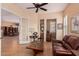 Inviting living room showcasing the view of the dining room and an adjacent office nook at 27792 N 129Th Ln, Peoria, AZ 85383