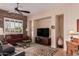 Inviting living room with neutral walls, stone accent wall, and modern furnishings at 27792 N 129Th Ln, Peoria, AZ 85383