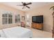 Bright main bedroom with white shutters and an exterior door with backyard access at 27792 N 129Th Ln, Peoria, AZ 85383