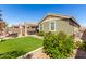 Landscaped backyard featuring artificial turf, patio seating, and a pergola at 2807 W Canada De Oro Rd, Queen Creek, AZ 85144