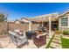 Outdoor living space with covered patio and artificial grass at 2807 W Canada De Oro Rd, Queen Creek, AZ 85144