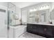 Bright bathroom featuring a glass shower, soaking tub, and double vanity at 2807 W Canada De Oro Rd, Queen Creek, AZ 85144