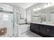 Bright bathroom with a glass shower, soaking tub, and double vanity at 2807 W Canada De Oro Rd, Queen Creek, AZ 85144