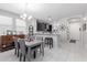 Cozy dining area with tile floors, neutral colors, and access to the kitchen at 2807 W Canada De Oro Rd, Queen Creek, AZ 85144