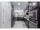 Well-lit kitchen features stainless steel appliances, quartz counters and dark cabinets at 2807 W Canada De Oro Rd, Queen Creek, AZ 85144