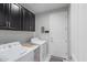 Efficient laundry room with modern washer, dryer, and storage cabinets at 2807 W Canada De Oro Rd, Queen Creek, AZ 85144