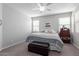 Bedroom with ceiling fan and natural light from two windows with blinds at 2807 W Canada De Oro Rd, Queen Creek, AZ 85144