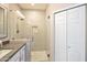 Bathroom with a tiled glass-enclosed shower, sleek countertop, and stylish accents at 2992 N Miller Rd # A202, Scottsdale, AZ 85251