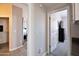 Hallway that provides a view into the walk-in closet, as well as the bedroom at 2992 N Miller Rd # A202, Scottsdale, AZ 85251