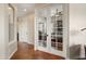 Hallway featuring tile floors and French doors to the living room at 30110 N 129Th Gln, Peoria, AZ 85383