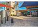 Striking building entrance with stone accents and mature palm trees, offering a grand welcome at 30550 N 125Th Dr, Peoria, AZ 85383